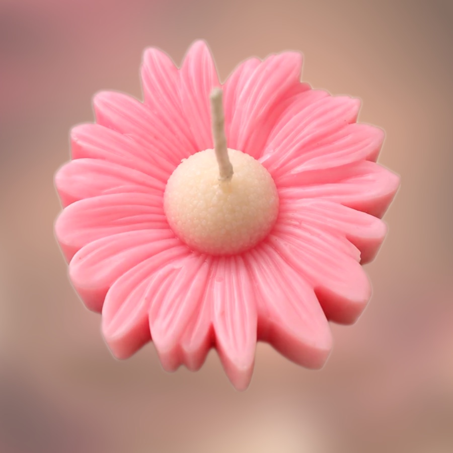 Handmade pink daisy flower candle with a cream centre by S2 Crafts