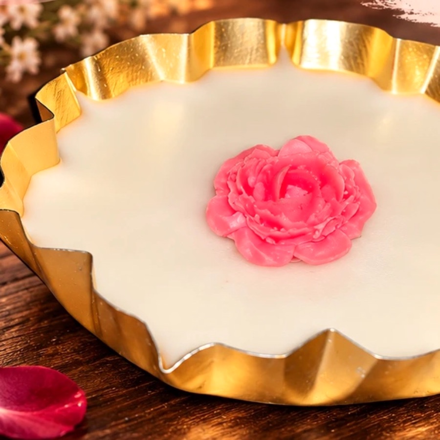 S2 Crafts gold platter candle with pink wax roses on Instagram